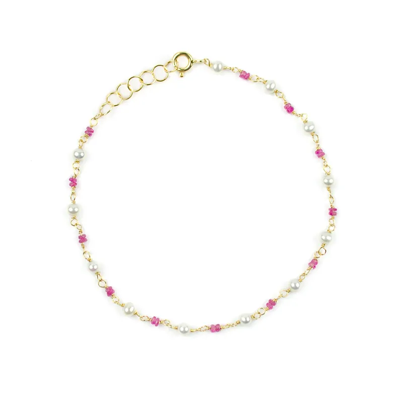Bracciale con rubini alternati a perle in oro giallo