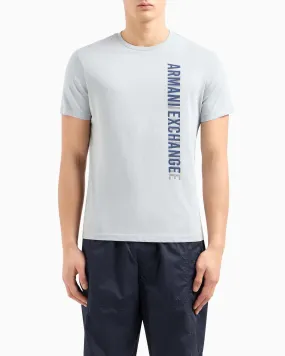 T-shirt color gesso in puro cotone con stampa logo verticale blu con ombreggiatura
